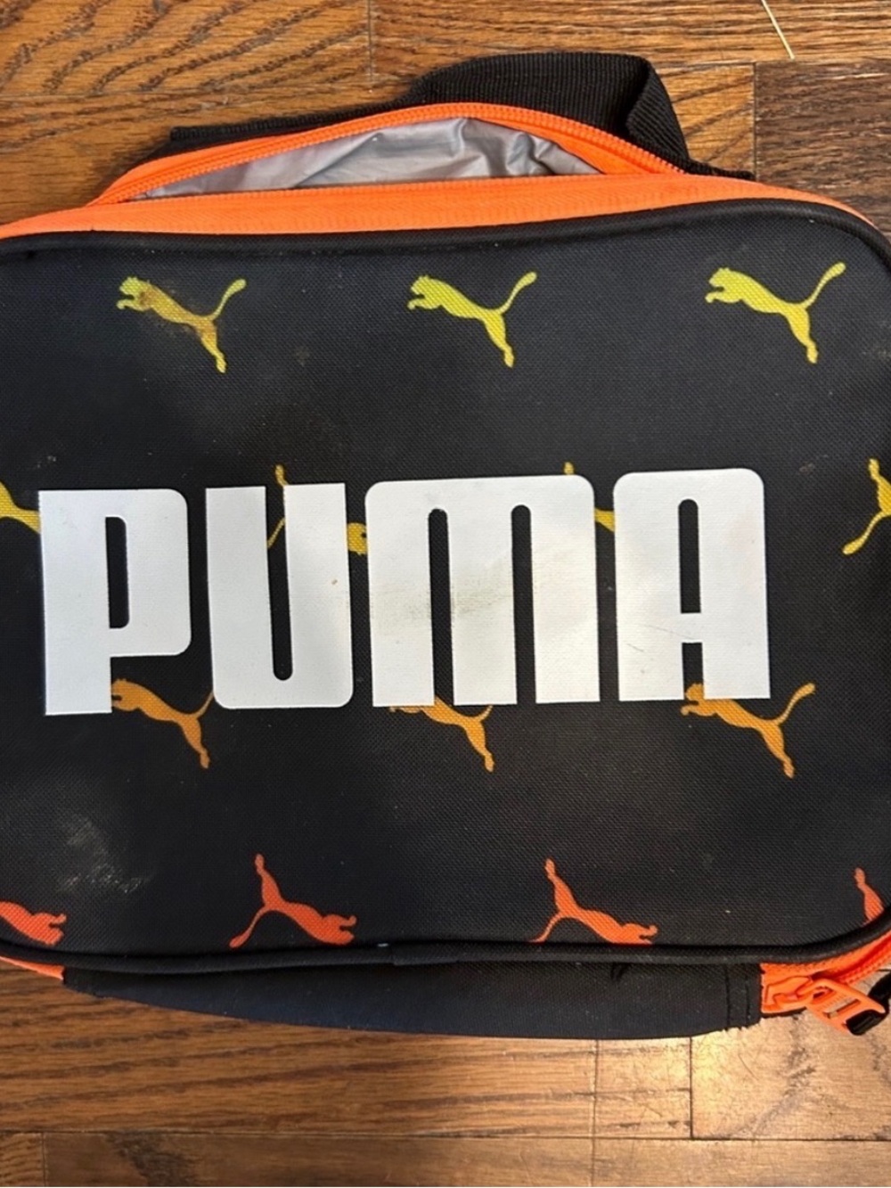 Puma Black Toiletry Bag with Orange and Yellow Puma Motifs